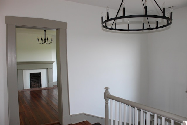 interior space with an inviting chandelier and hardwood / wood-style floors