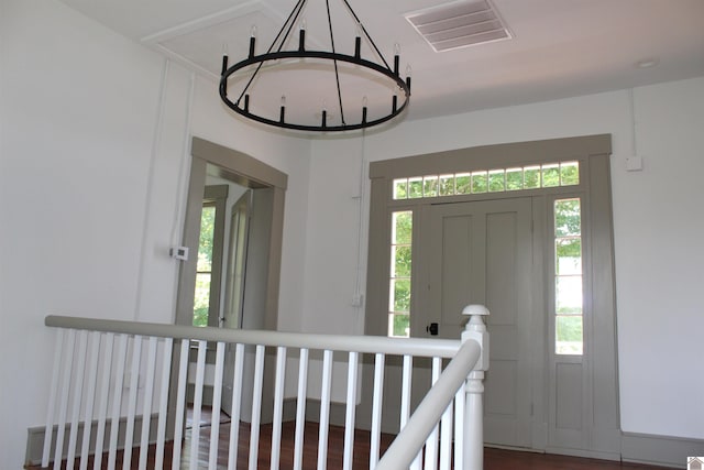 entryway with plenty of natural light and hardwood / wood-style flooring