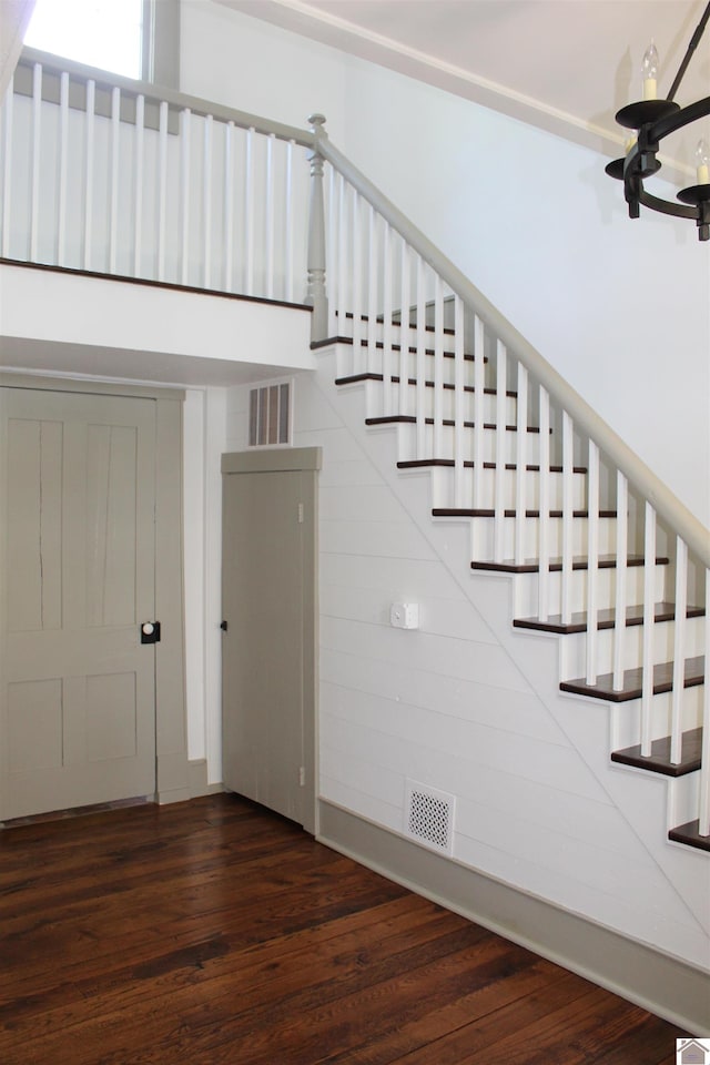 stairs with hardwood / wood-style flooring