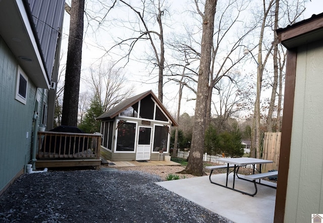 view of yard with a patio area and a sunroom