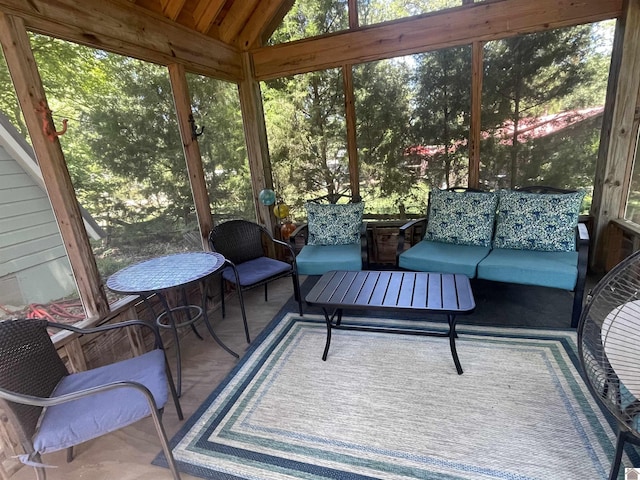 sunroom / solarium with vaulted ceiling