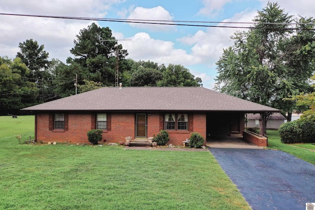 ranch-style home with a front lawn and a carport