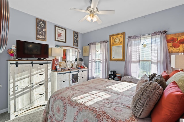 carpeted bedroom featuring multiple windows