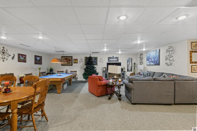 living room with pool table, a paneled ceiling, and light colored carpet