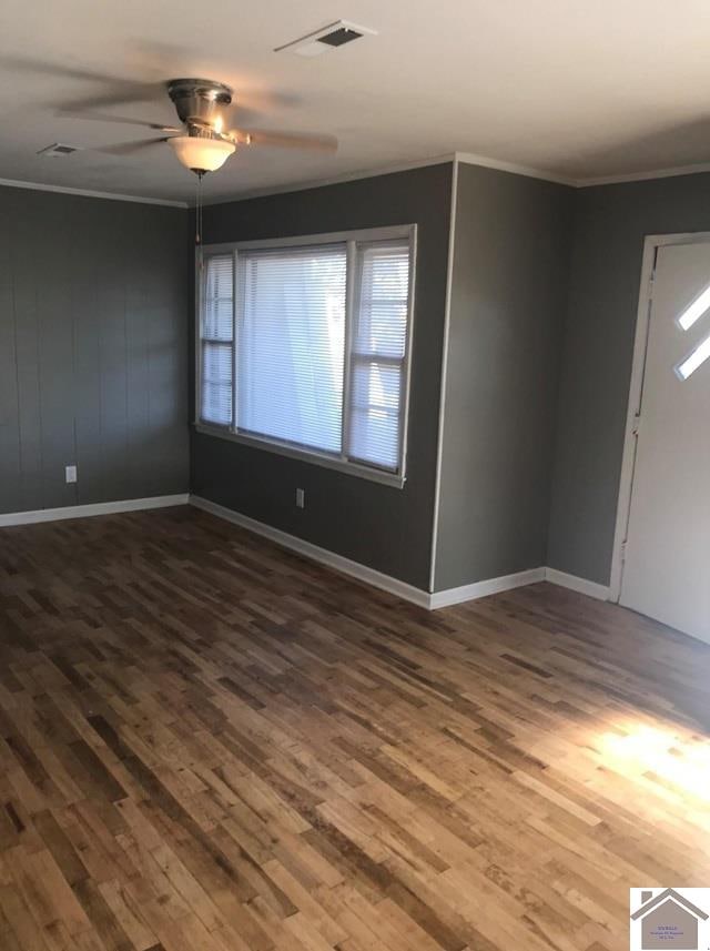 unfurnished room with ceiling fan and wood-type flooring