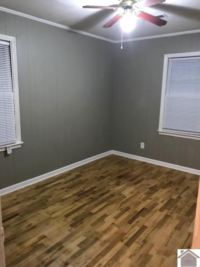 unfurnished room with ceiling fan, ornamental molding, and hardwood / wood-style floors