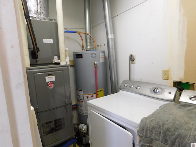 laundry area featuring washing machine and dryer and gas water heater