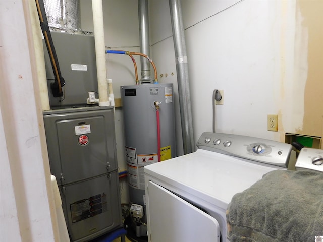 clothes washing area with heating unit, water heater, and washing machine and clothes dryer