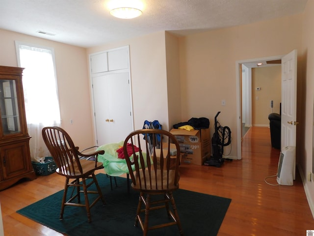 dining space featuring hardwood / wood-style floors