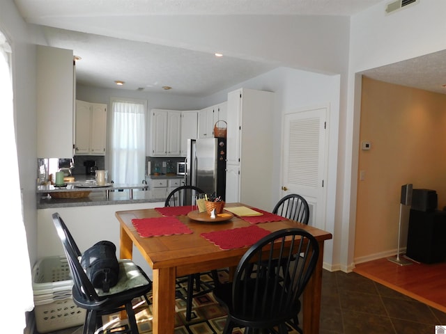 dining area featuring dark hardwood / wood-style floors