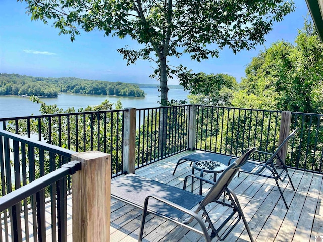 deck featuring a water view