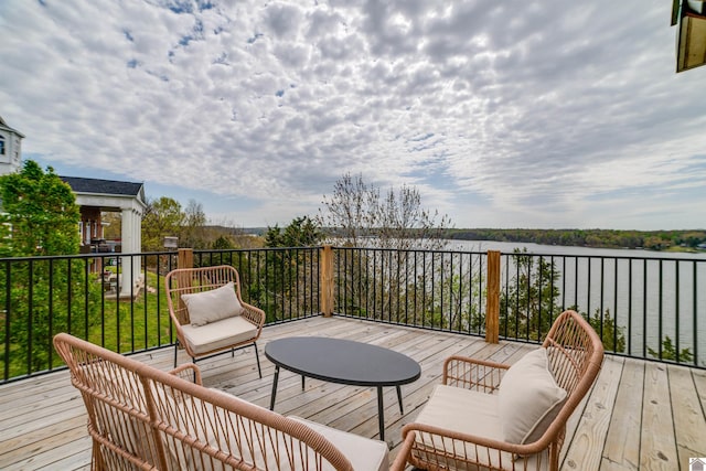 wooden terrace with a water view