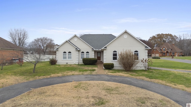 ranch-style house with a front lawn