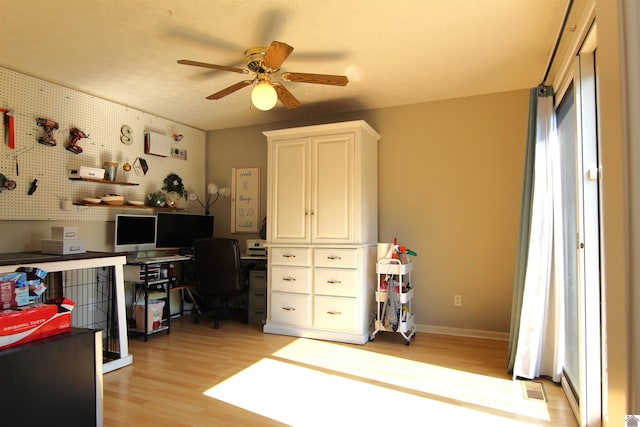 office space with ceiling fan and light hardwood / wood-style floors