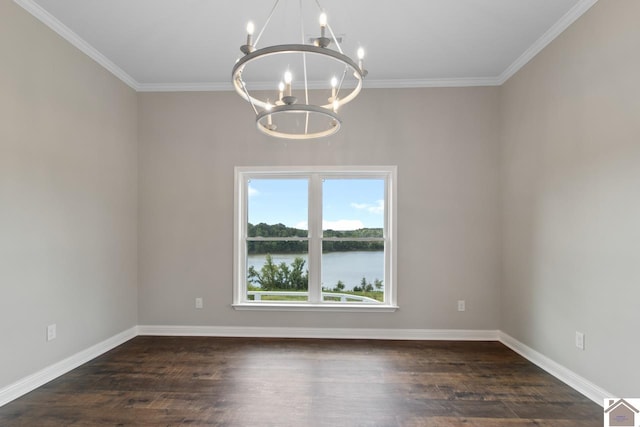 spare room featuring a notable chandelier, crown molding, dark wood-type flooring, and a water view