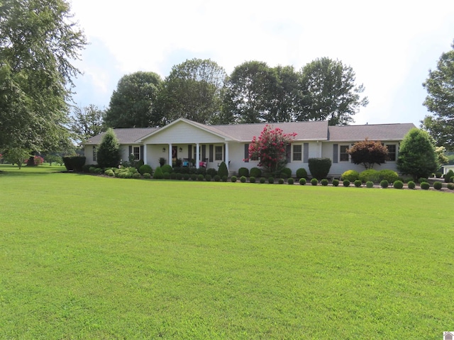 ranch-style home with a front yard