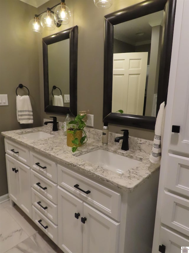 bathroom featuring dual bowl vanity and tile patterned flooring