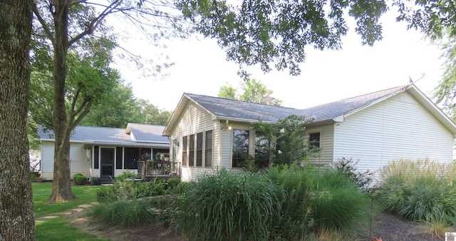 exterior space featuring a sunroom