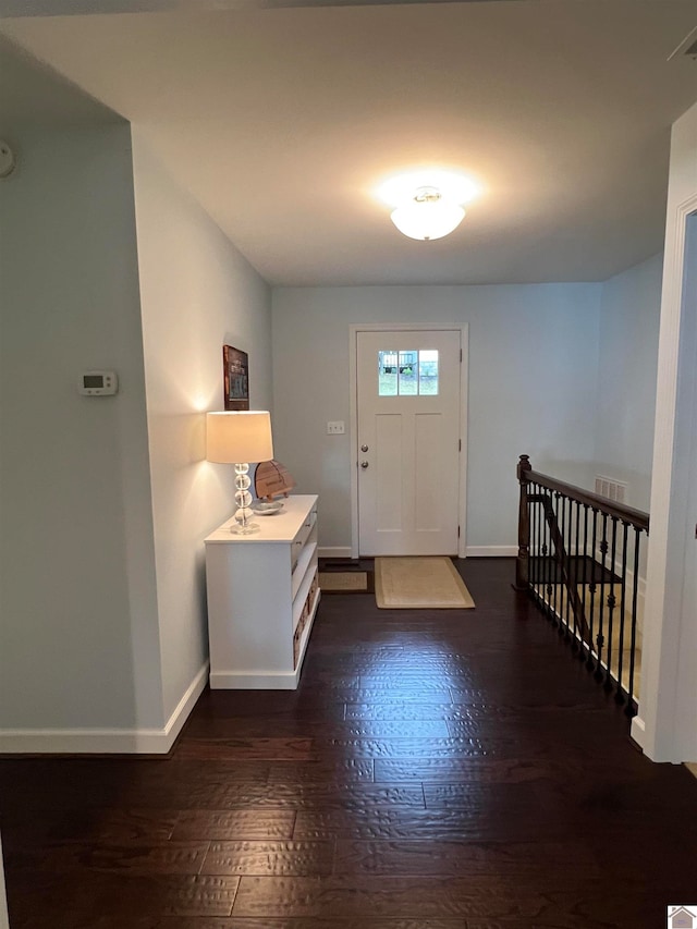 foyer entrance with dark wood-type flooring