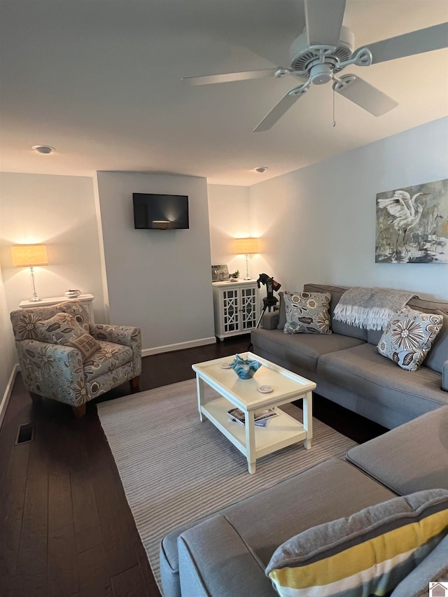 living room featuring ceiling fan and wood-type flooring