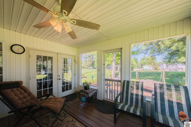 sunroom / solarium featuring french doors and ceiling fan