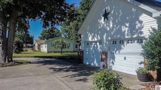 view of side of home with a yard