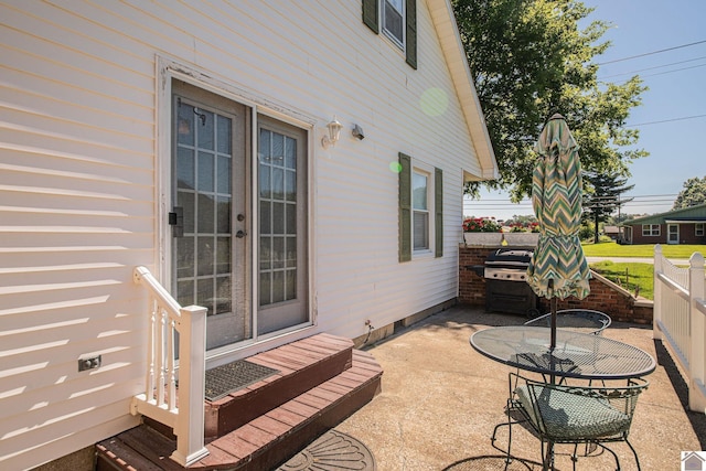 view of patio / terrace featuring fence