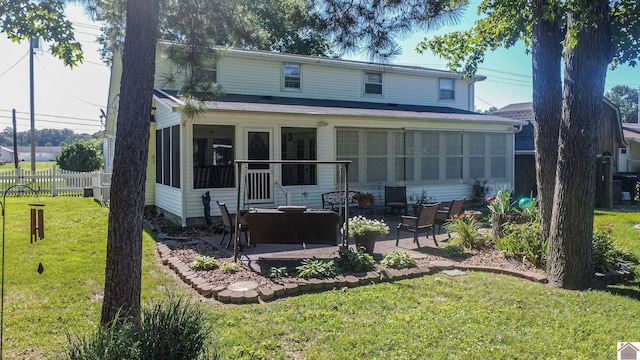 view of front of house with a patio and a front yard