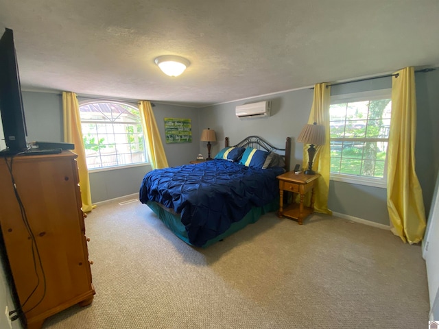 carpeted bedroom featuring a textured ceiling, an AC wall unit, and multiple windows