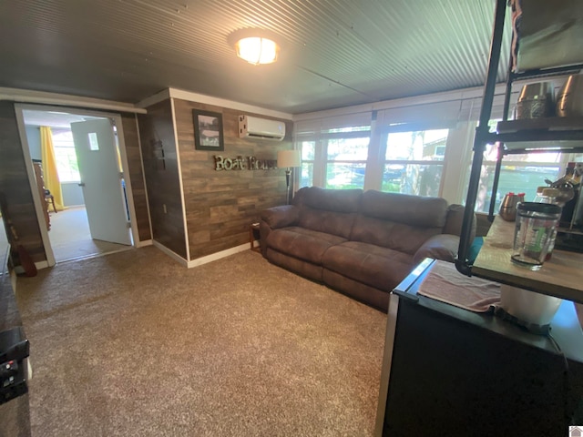 carpeted living room with a wall mounted AC and wood walls