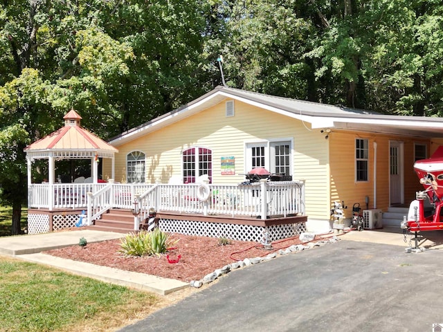 ranch-style home with a deck and a gazebo