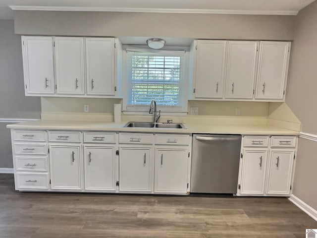 kitchen with sink, white cabinets, stainless steel dishwasher, and hardwood / wood-style flooring