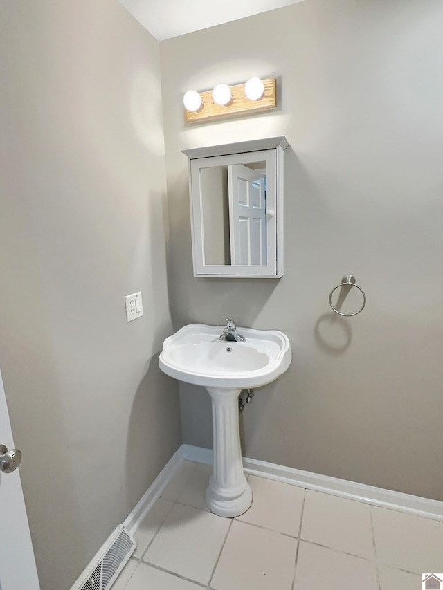 bathroom with tile patterned floors