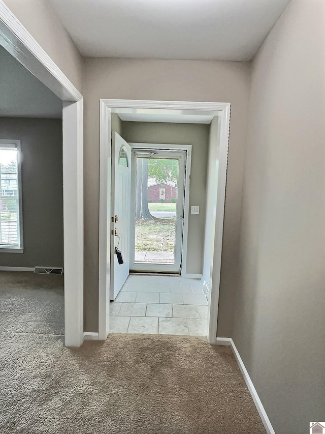 entryway featuring carpet flooring