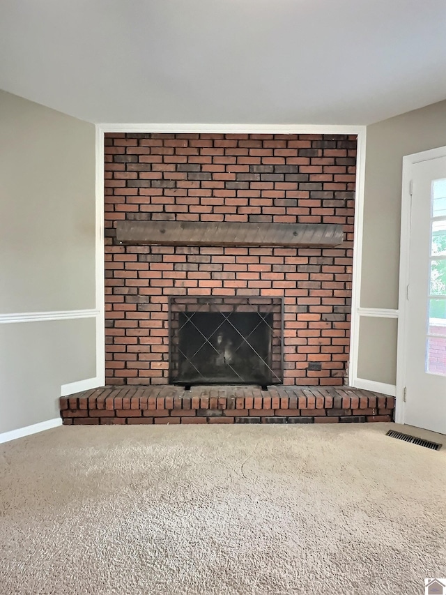 details with carpet floors and a brick fireplace