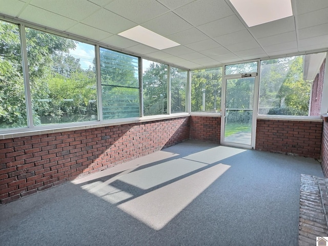 sunroom / solarium featuring a drop ceiling