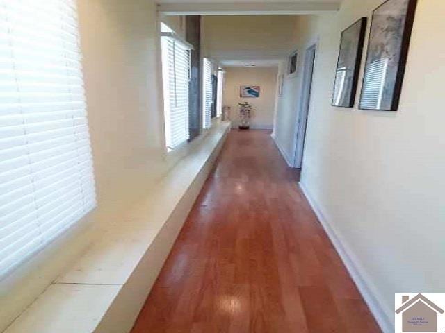 corridor featuring hardwood / wood-style floors