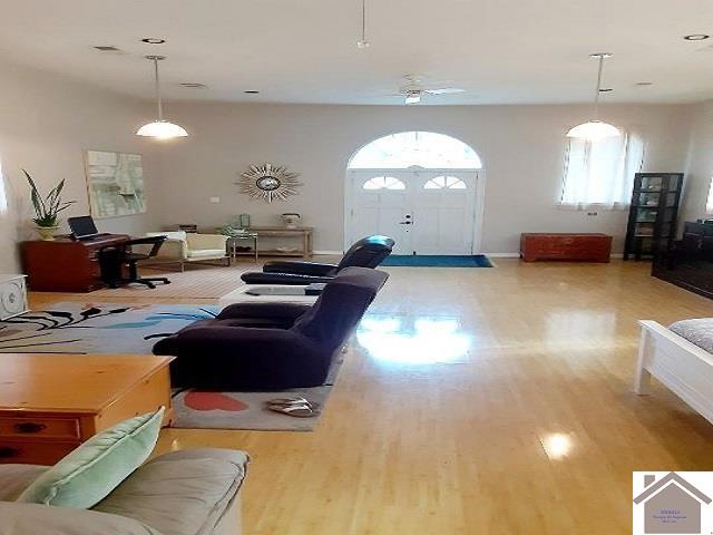 living room with light hardwood / wood-style flooring