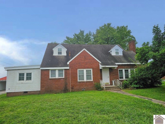 new england style home with crawl space, brick siding, a chimney, and a front lawn