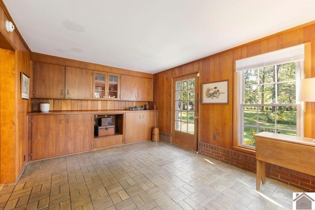 interior space featuring plenty of natural light and wooden walls