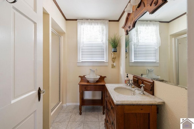 bathroom with a wealth of natural light, tile patterned flooring, crown molding, and vanity