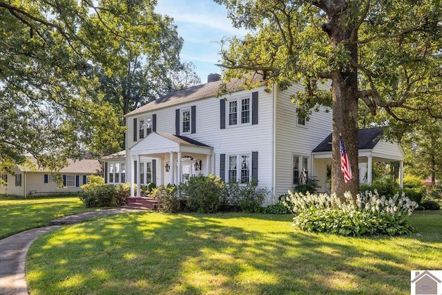 colonial-style house with a front yard