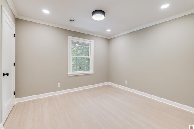 unfurnished room featuring light hardwood / wood-style floors and ornamental molding