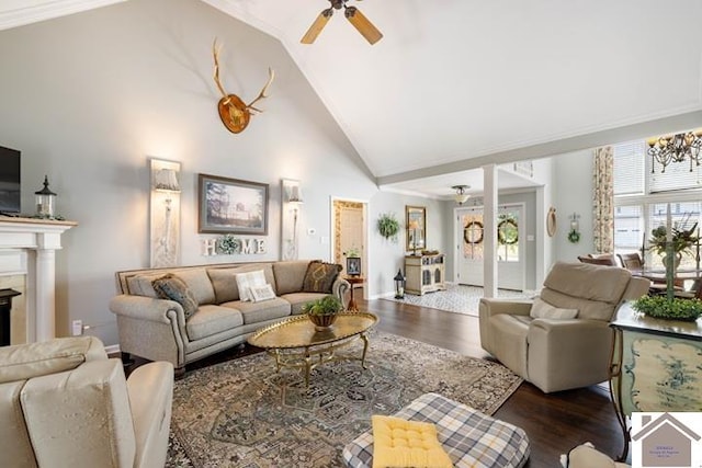 living room with high vaulted ceiling, ceiling fan, hardwood / wood-style floors, and crown molding