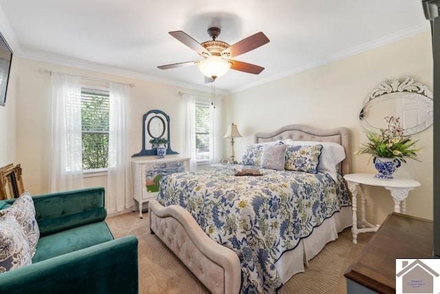 bedroom featuring ceiling fan, crown molding, and light colored carpet