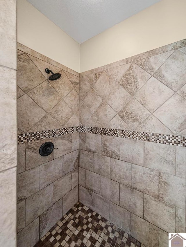 bathroom with a tile shower