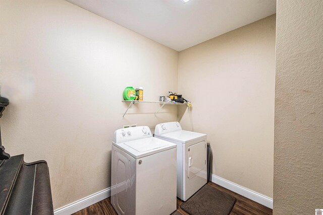 washroom featuring washer and dryer and dark hardwood / wood-style floors