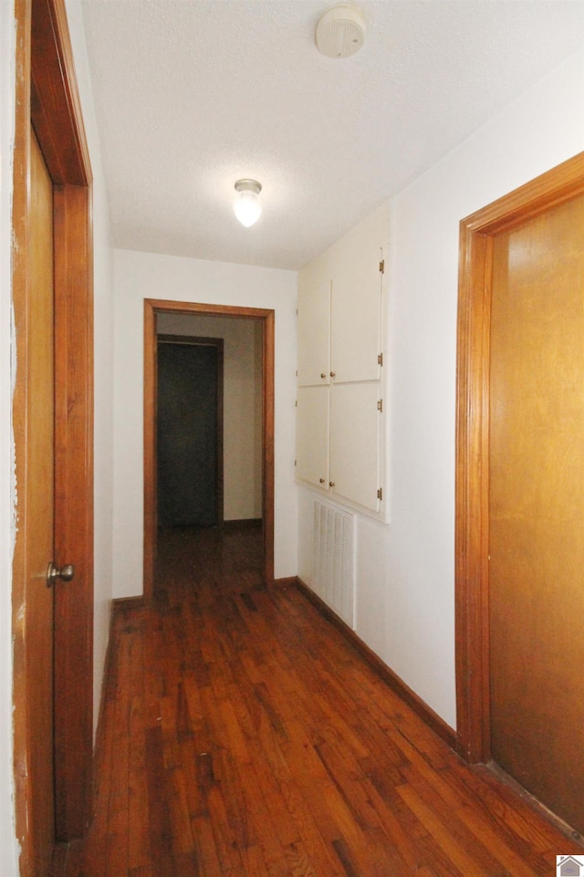 hallway featuring hardwood / wood-style flooring