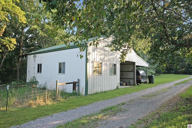 view of side of home featuring a carport