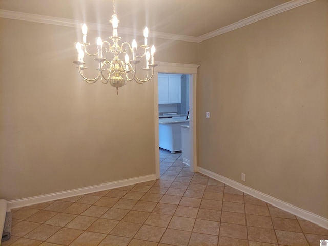 tiled spare room with crown molding and a chandelier